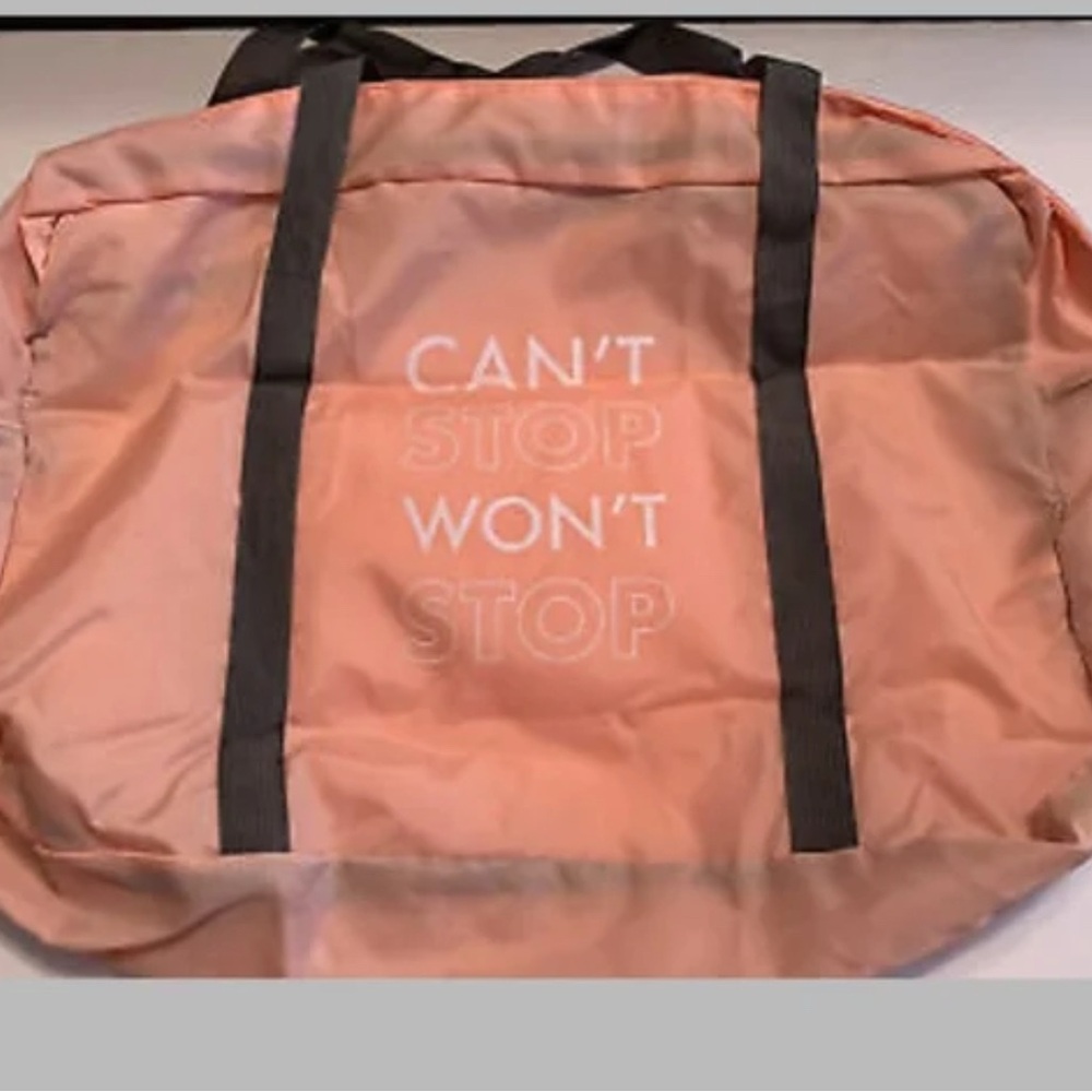 Izzy and Liv Chic Coral Travel Bag with Black Handles